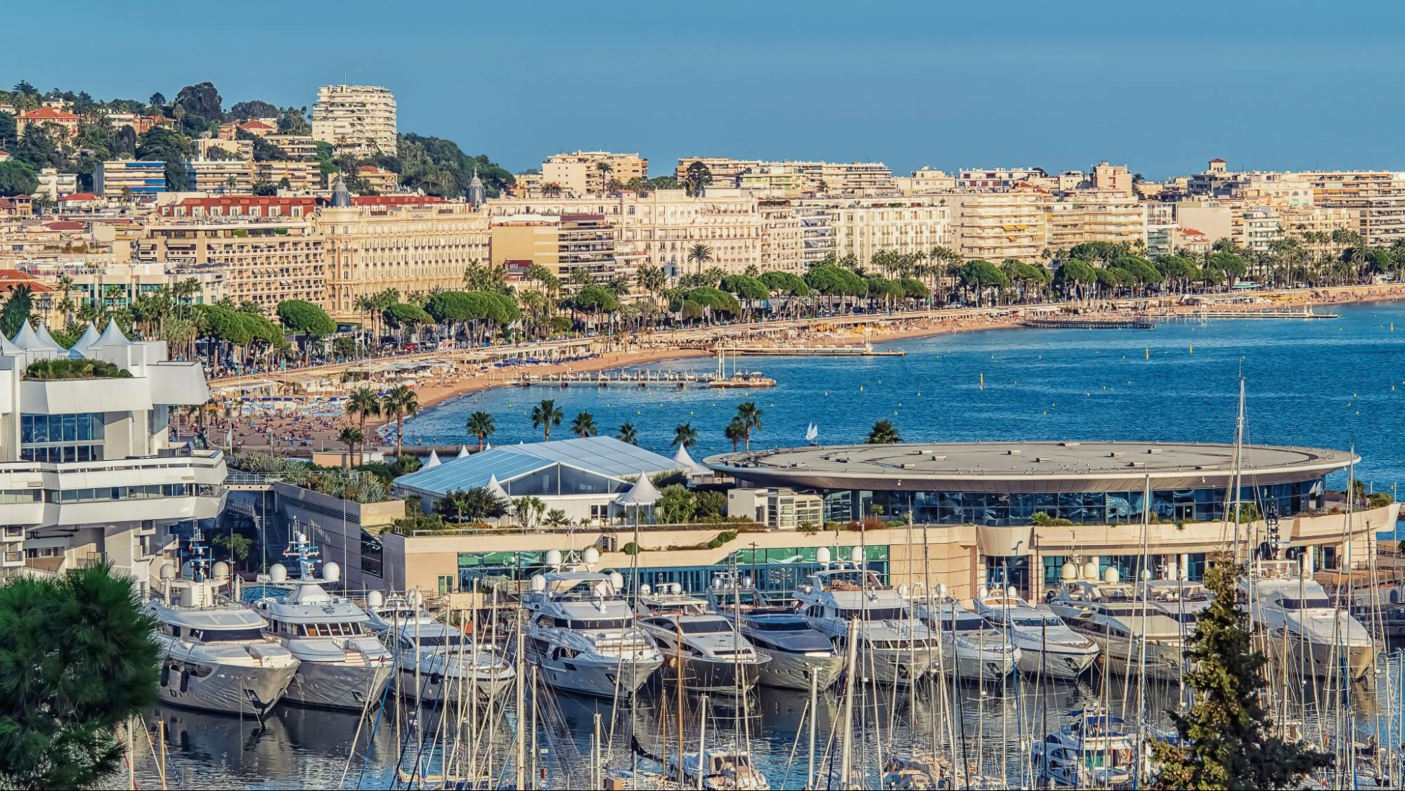 Cannes' harbour with yachts docked on a bright clear day