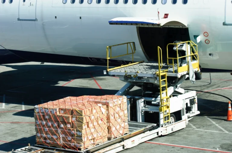 A delivery being loaded on to a plane to be sent to its destination.