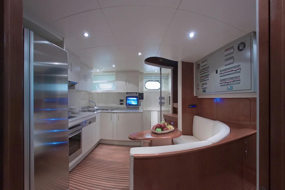 Luxury galley within a superyacht and furnishings beside the kitchen.
