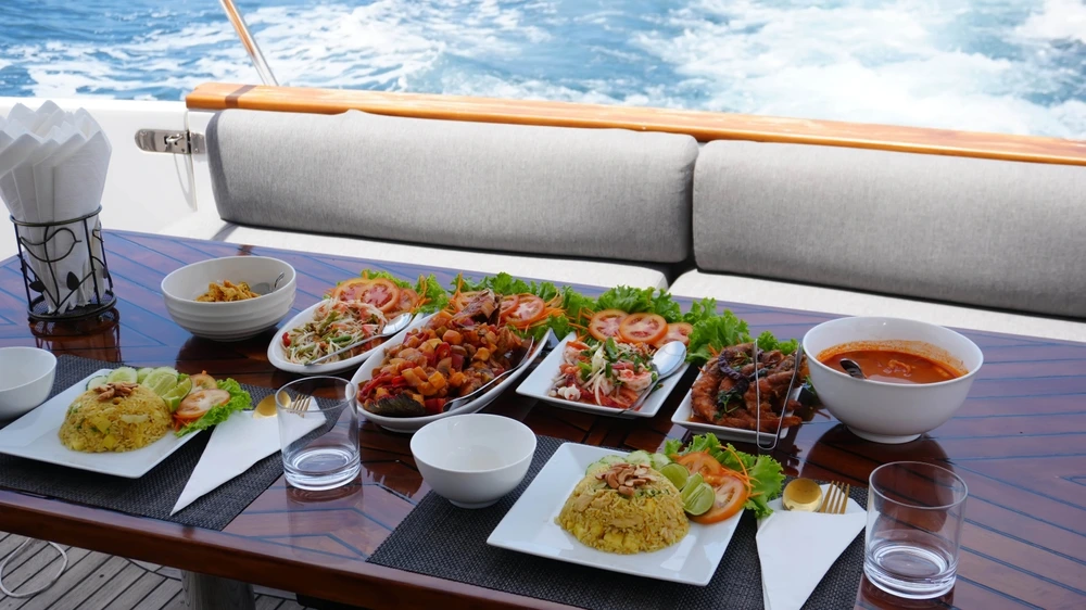 Food prepared and presented on a table in the yacht exterior.
